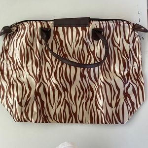 Big animal print bag 20”x 14”. Snaps in the front.